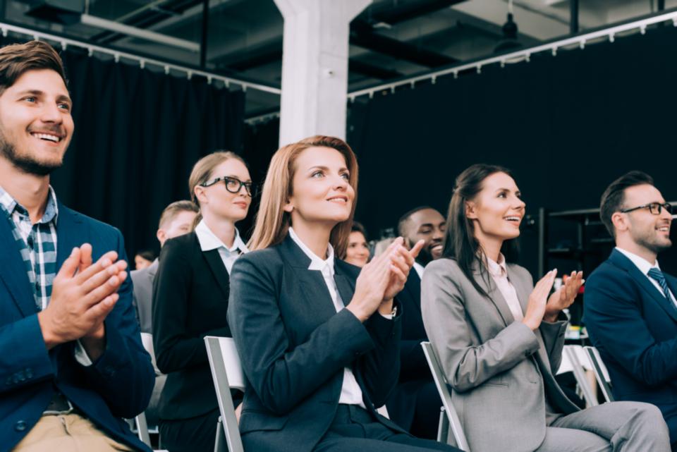 Audience applauding a keynote speaker